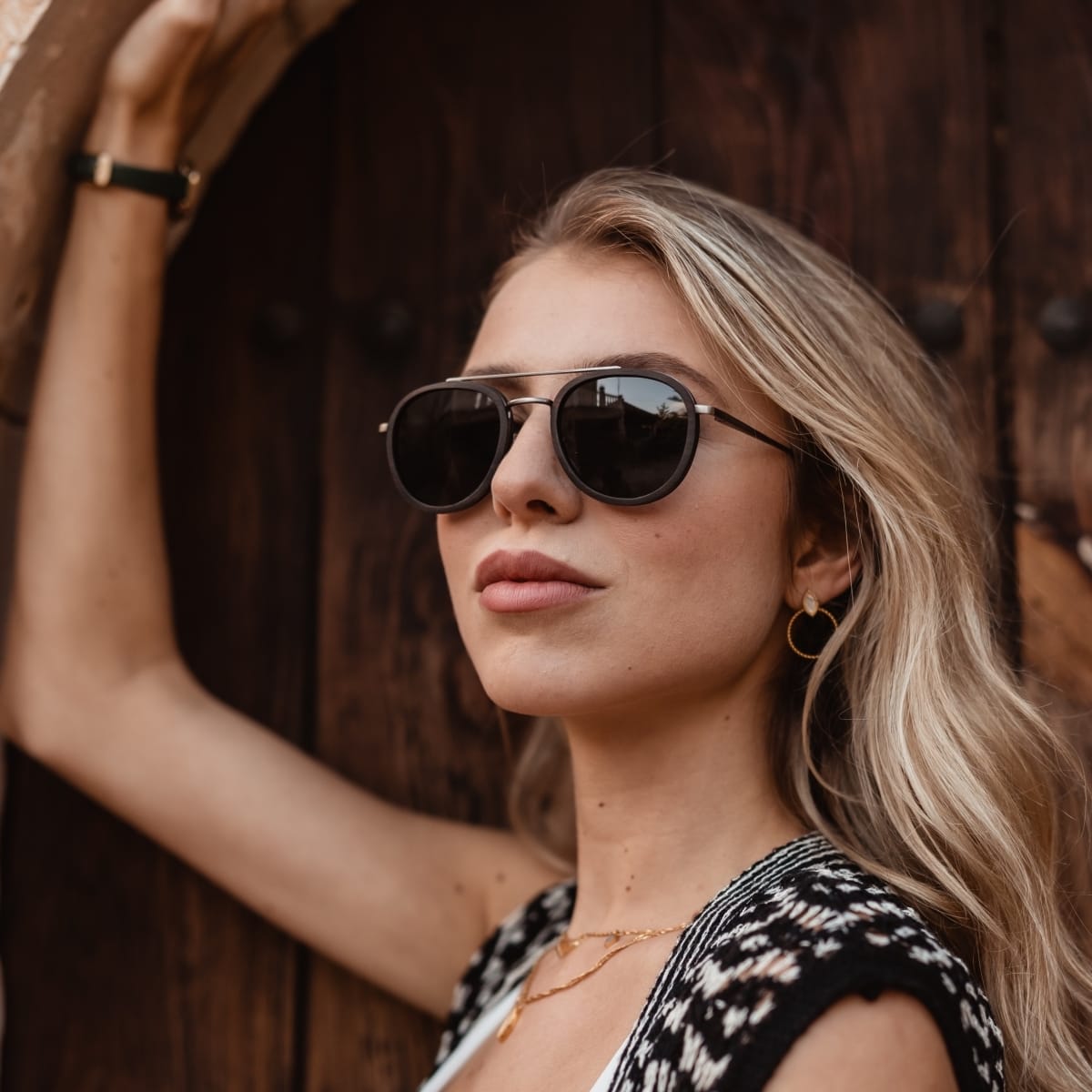 "The Risky" sunglasses with a stylish leadwood and antique silver finish.