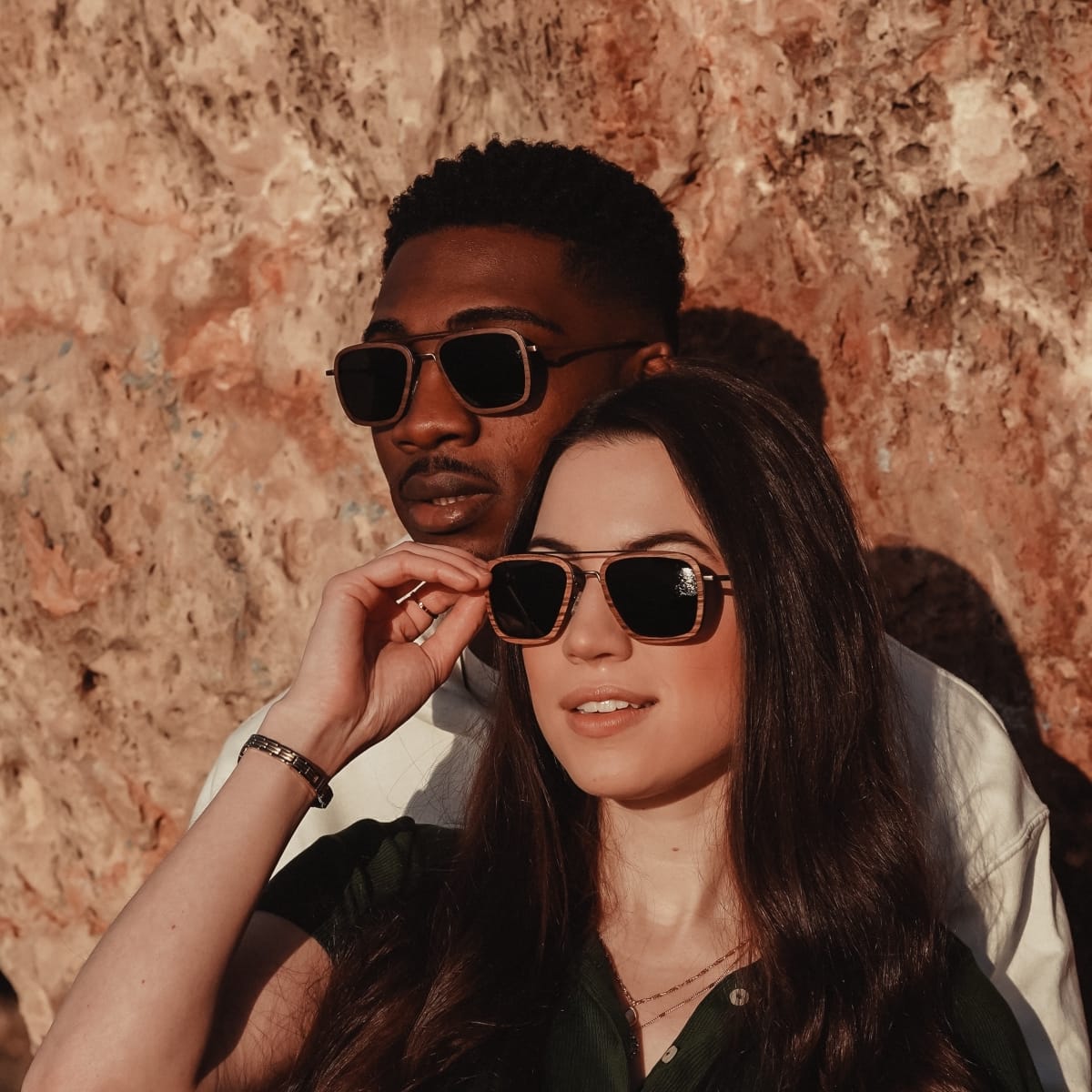 "The Logician" sunglasses showcasing zebrawood frames and dark grey lenses with a stylish design.