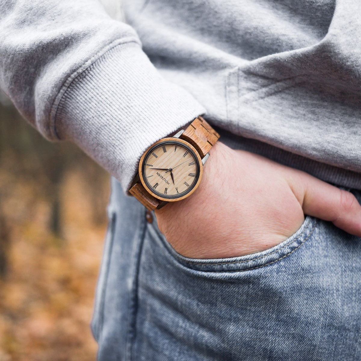 "Taro" wooden wristwatch featuring oak design and casual style on wrist.
