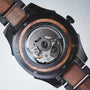 "Albert, a wristwatch combining acacia wood accents with a sleek mechanical design."