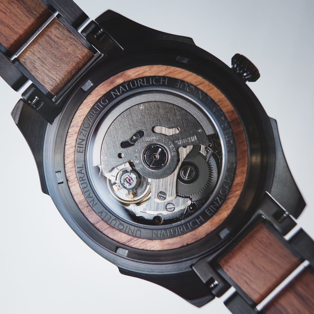 "Albert, a wristwatch combining acacia wood accents with a sleek mechanical design."