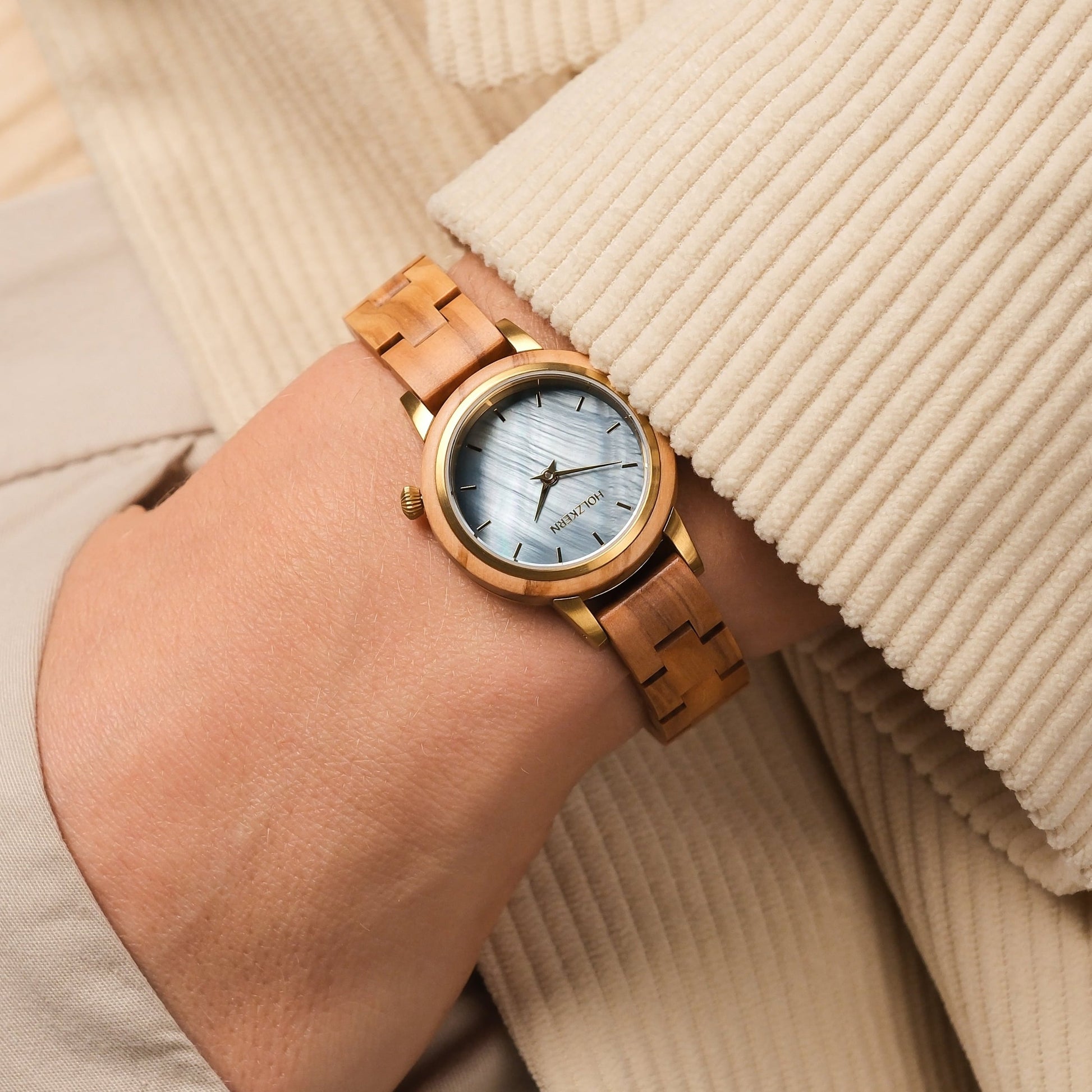 "Antrim" watch featuring an olive and nacre design with a stylish, elegant appearance.