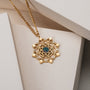 "Aphonia Necklace" necklace featuring a gold design and green marble accents.