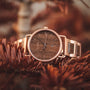 "Belvue" watch with a walnut face and rose gold accents, blending natural and elegant styles.