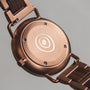 "Belvue" watch featuring a walnut design with a sleek, modern style.