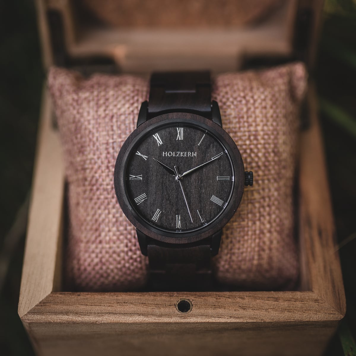 "Carlos" watch in a wooden box, featuring a dark wood finish and minimalist design.