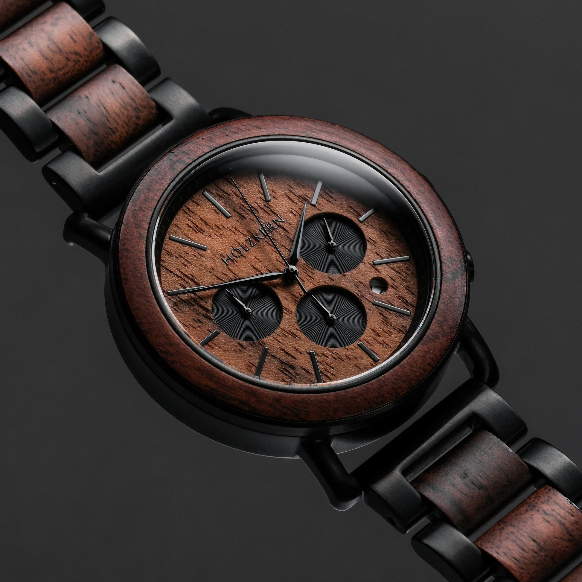 "Dusk" watch, featuring a walnut and black finish, showcases a sleek and elegant design.