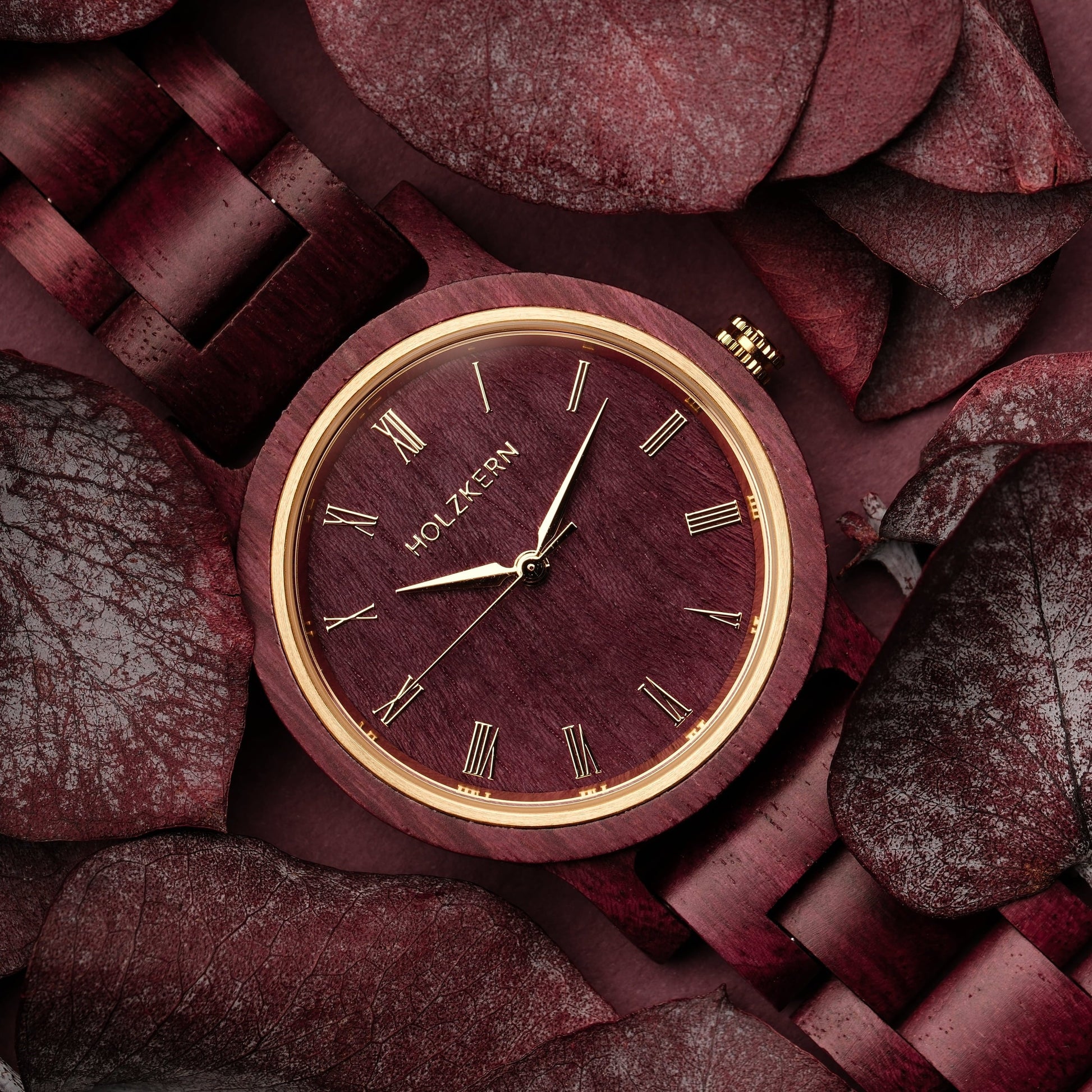 "Calm" watch in Amaranth, featuring an elegant design with wooden elements and a vibrant color scheme.