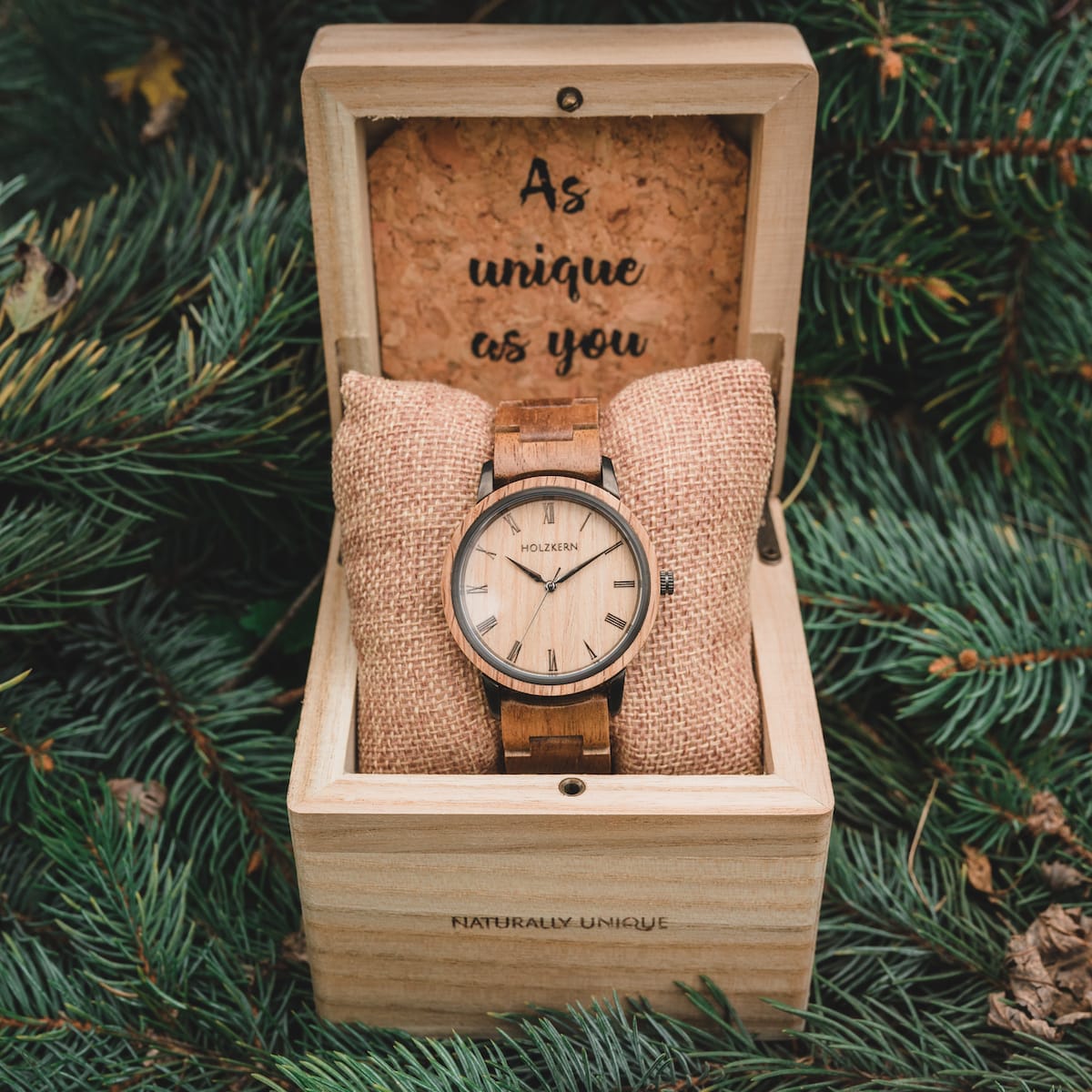 "Taro" wooden watch, featuring an elegant oak design, displayed in a natural wooden box with a cushion.