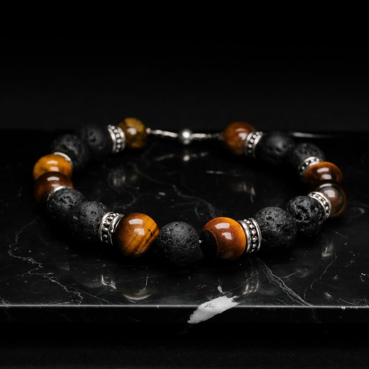 "Superset" bracelet featuring tiger eye and lava stones with a bold, natural style.