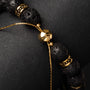 "Superset", a bracelet with lava stone and gold accents, showcases a bold and elegant style.