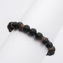 "Superset" bracelet, featuring black lava beads and gold accents, exudes a bold and stylish look.