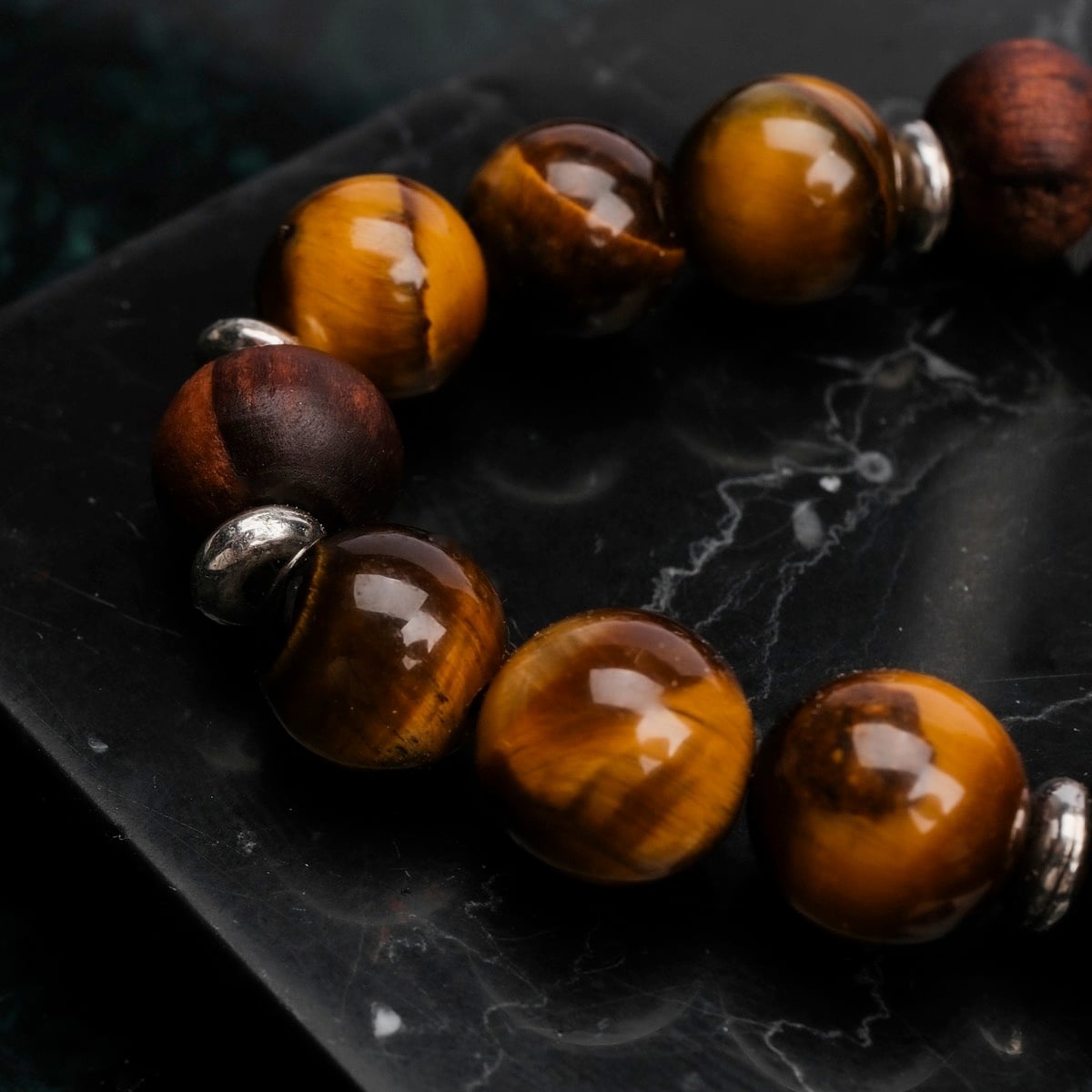 "Superset" bracelet featuring tiger eye and walnut, with a sleek, polished style.