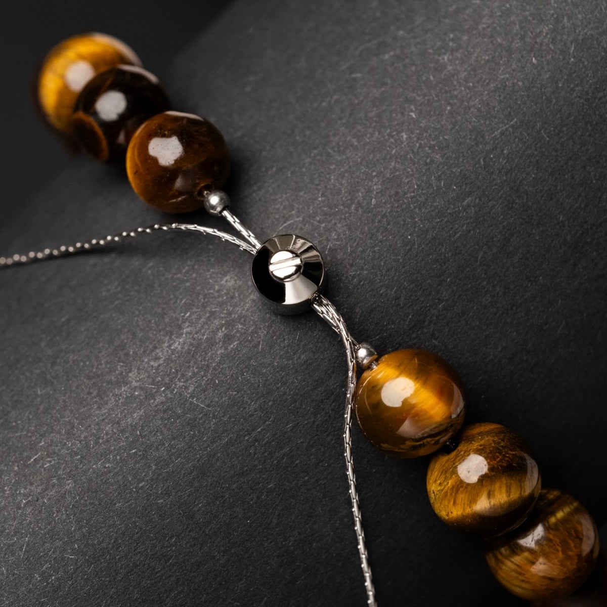"Superset" bracelet, featuring polished tiger eye and walnut beads on an elegant string.