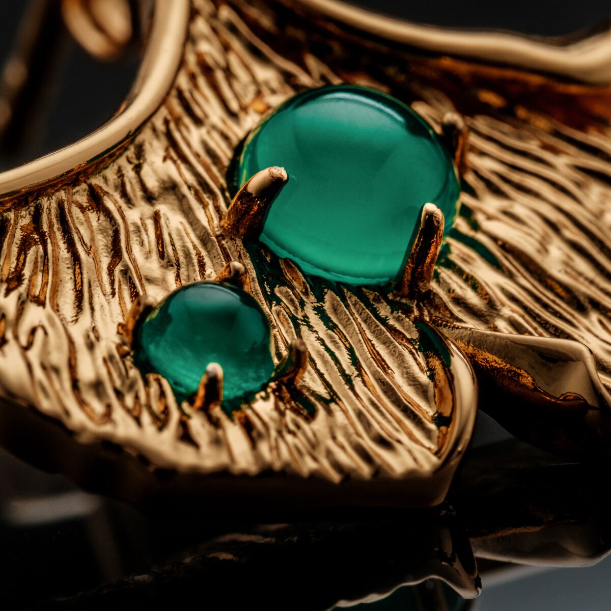 "Chalice Earrings" earrings feature chalcedony stones set in textured gold for an elegant and sophisticated look.