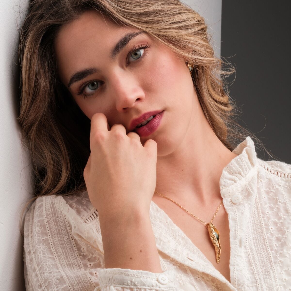 "Chalice Necklace", a stylish pendant necklace with Amazonite and gold accents, exudes elegance and sophistication.