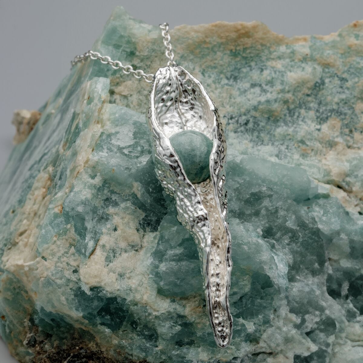 "Chalice Necklace", a silver and amazonite necklace, featuring a textured organic style.