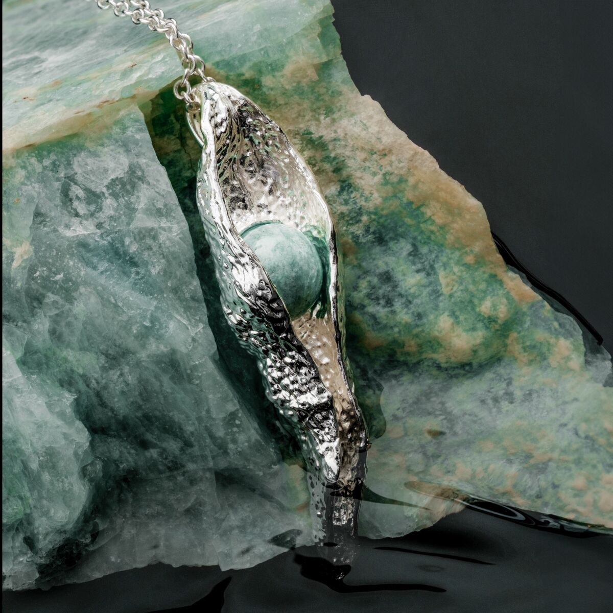 "Chalice Necklace": Elegant necklace with amazonite stone and silver finish, evoking natural beauty and sophistication.