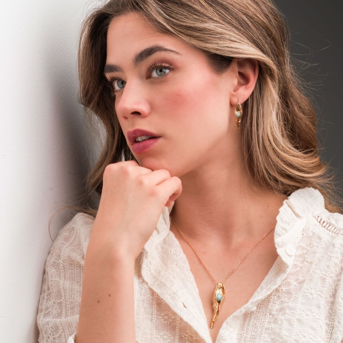 "Chalice Necklace" necklace, featuring elegant amazonite and gold materials, worn with a sophisticated, delicate style.