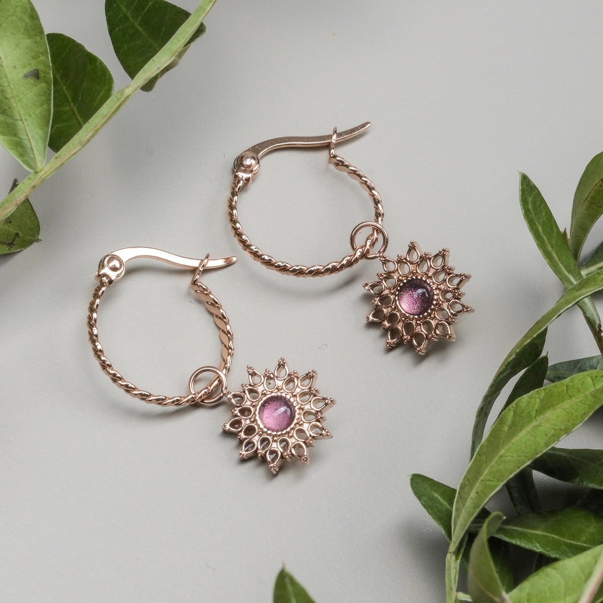 Suncatcher Earrings - elegant rose gold earrings with amethyst accents and intricate design.