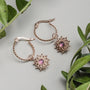 Suncatcher Earrings - elegant rose gold earrings with amethyst accents and intricate design.