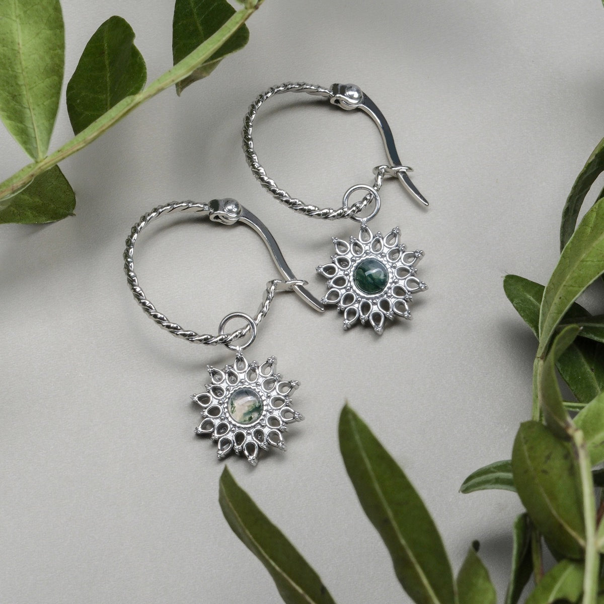 Suncatcher Earrings: elegant earrings with a marble and silver design, showcasing a sunburst style.