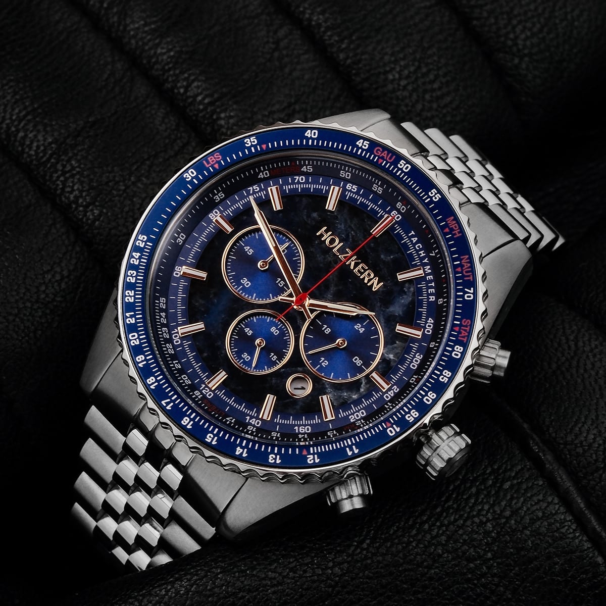 "Openhorizon" watch featuring a blue marble face and silver band, exuding a bold and sophisticated style.