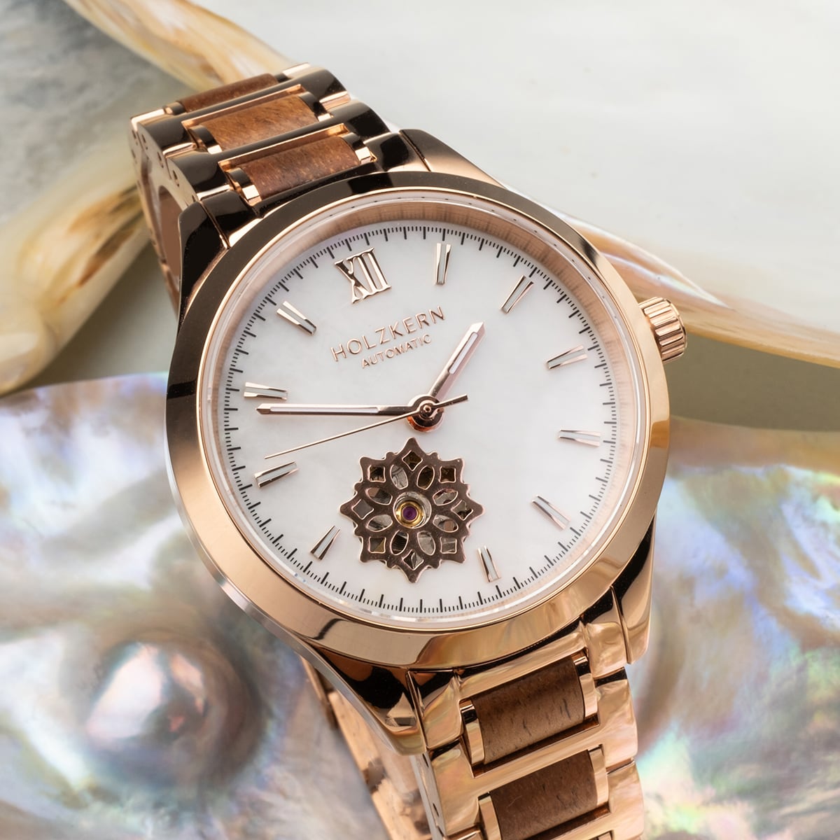 "Kaleidoscopic" watch with nacre dial and koa wood accents, featuring an elegant and modern design.