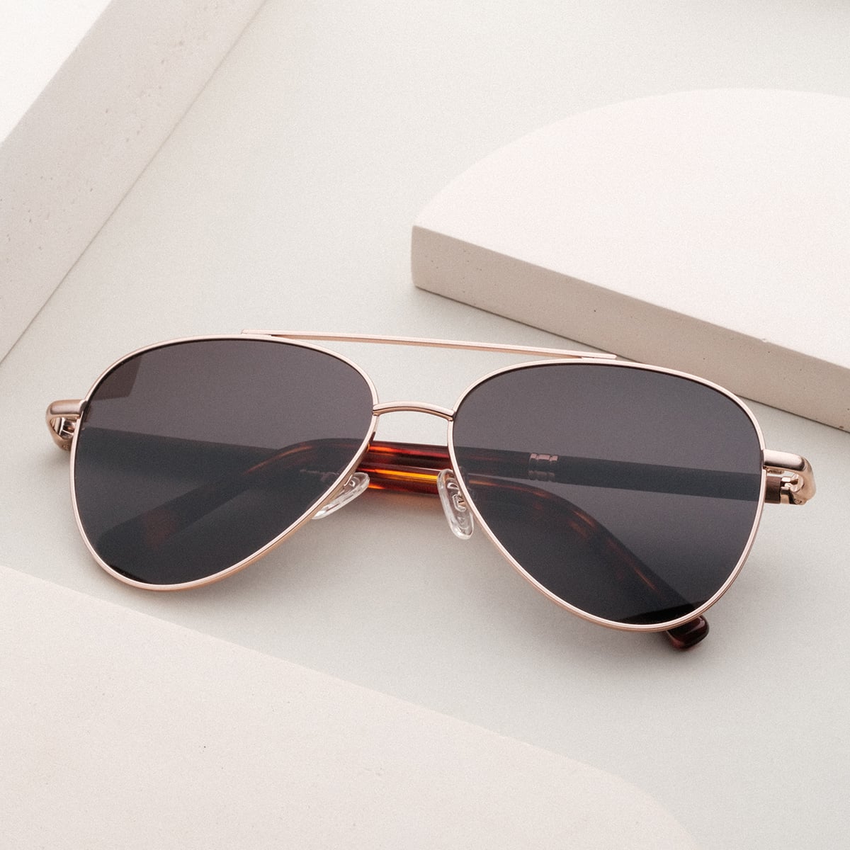 "The Badass I" sunglasses featuring a stylish walnut and matte gold finish with a sleek, modern design.