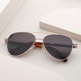 "The Badass I" sunglasses featuring a stylish walnut and matte gold finish with a sleek, modern design.