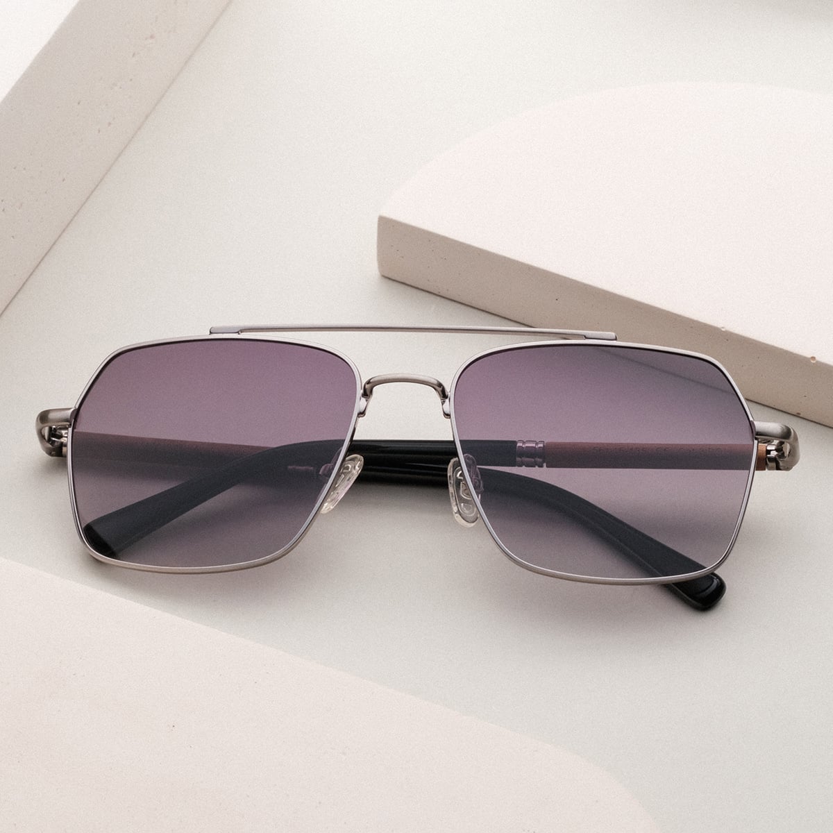 "The Professor" sunglasses with a walnut and antique silver finish, featuring a sleek and sophisticated design.