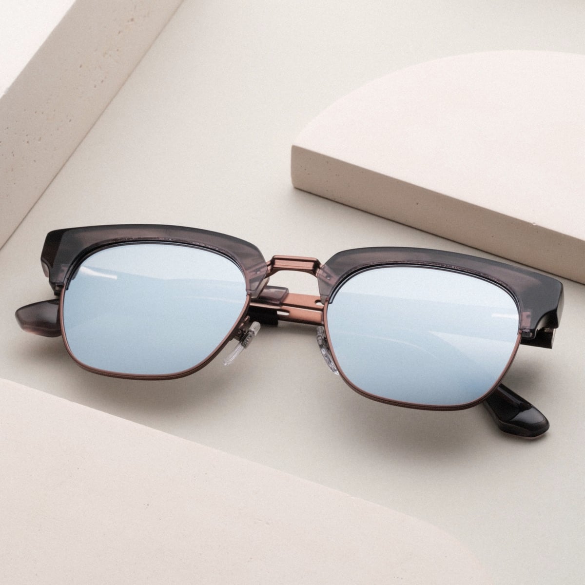"The Virtuoso" sunglasses with a sleek, modern design, featuring a combination of Leadwood and Ash materials.