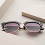 "The Virtuoso" sunglasses in Leadwood/Black havana style with a chic, modern design.