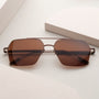 "The Visionary", walnut and bronze sunglasses with a sleek, modern design.