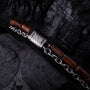 "Supersonic" bracelet featuring Walnut and Silver Elements with a sleek chain design.