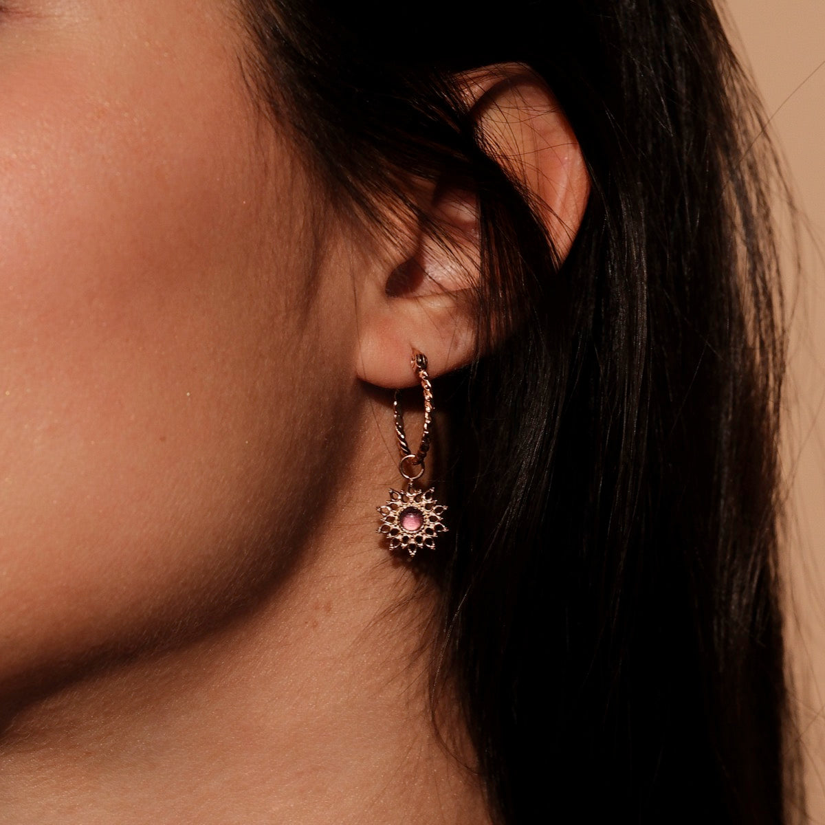 "Suncatcher Earrings": Elegant rose gold earrings featuring amethyst, with a delicate, sun-inspired design.