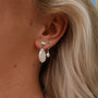Summersweet Earrings features elegant baroque pearl earrings with a silver accent, highlighting a chic and natural style.