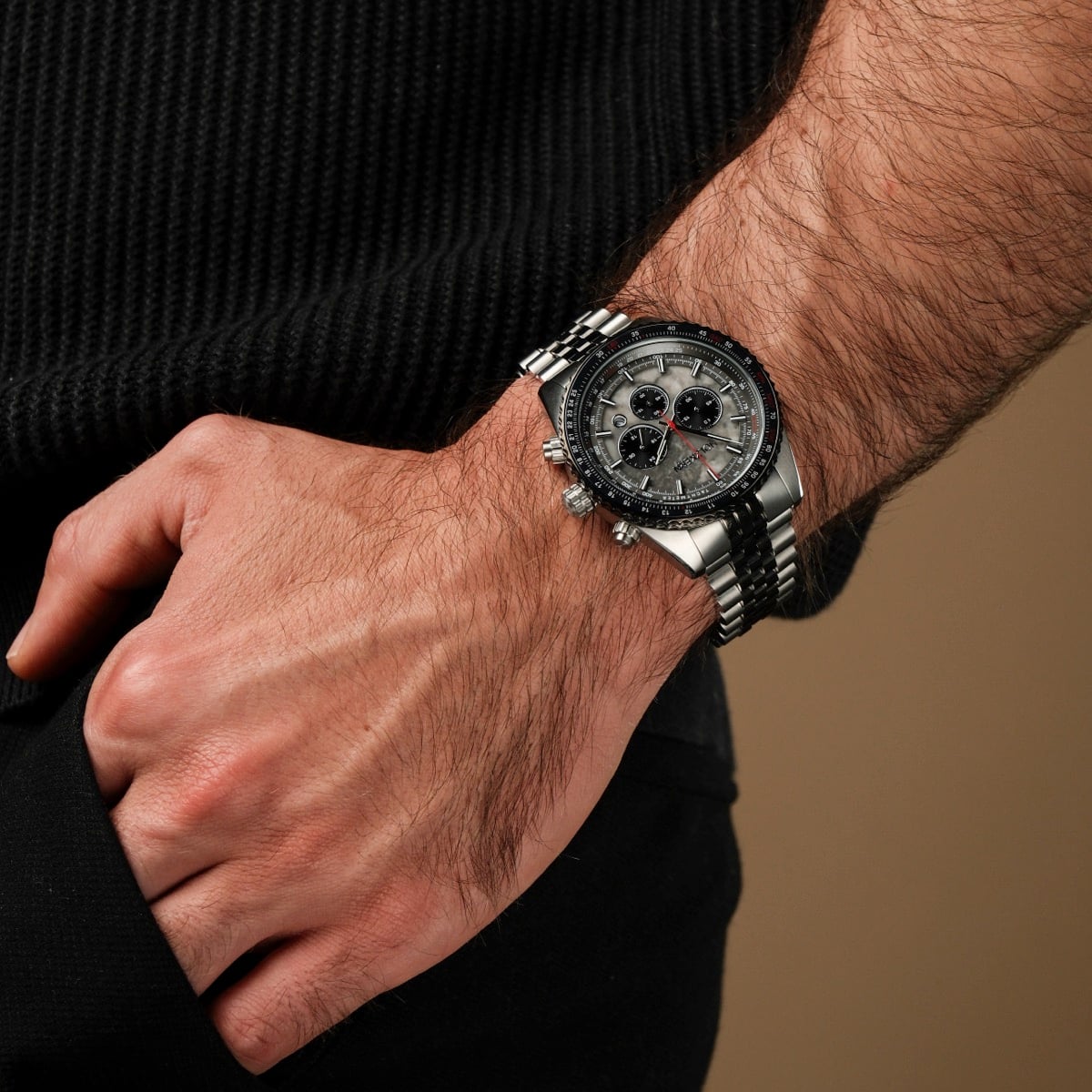 "Openhorizon" watch features a gray marble face and silver-accented design, worn on wrist.