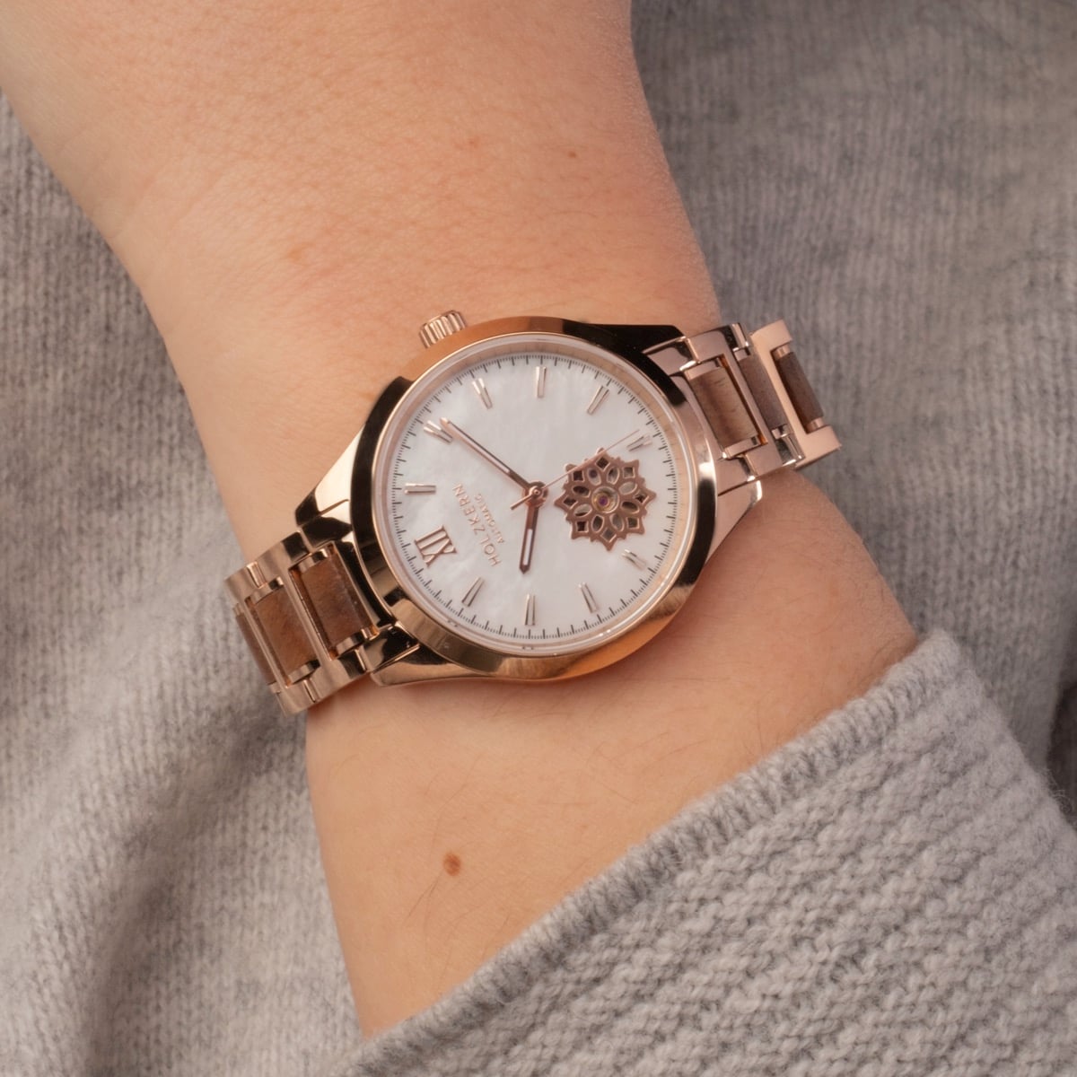 "Kaleidoscopic" watch with nacre and koa materials, showcasing an elegant, rose-gold and wood-accented design.