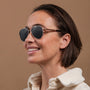 "The Badass I" sunglasses in walnut and matte gold, featuring a sleek and modern design.