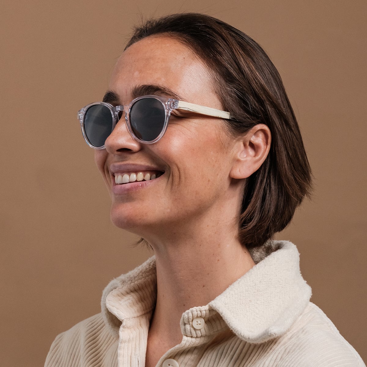 "The Hyped" sunglasses showcase a stylish zebrawood and crystal design.