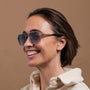 "The Professor" sunglasses feature a walnut and antique silver finish with a modern, elegant design.