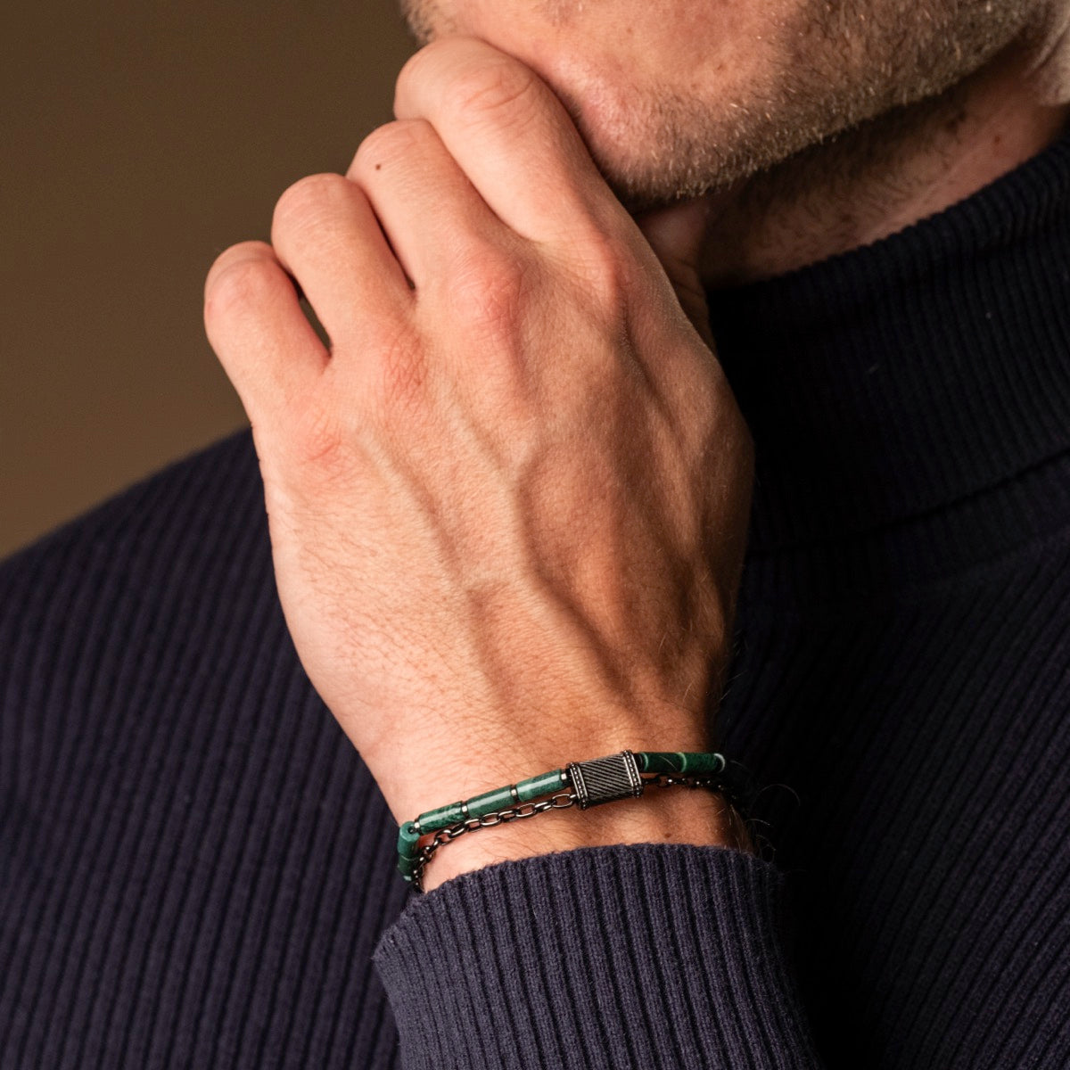 "Supersonic" bracelet with aventurine and gray accents, showcasing a stylish, sophisticated design on a man's wrist.