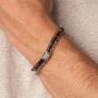 "Supersonic" bracelet, featuring a walnut and silver design, showcasing sleek and stylish craftsmanship.