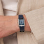 "Memoire" watch, featuring a rectangular face with agate visuals and blue accents.