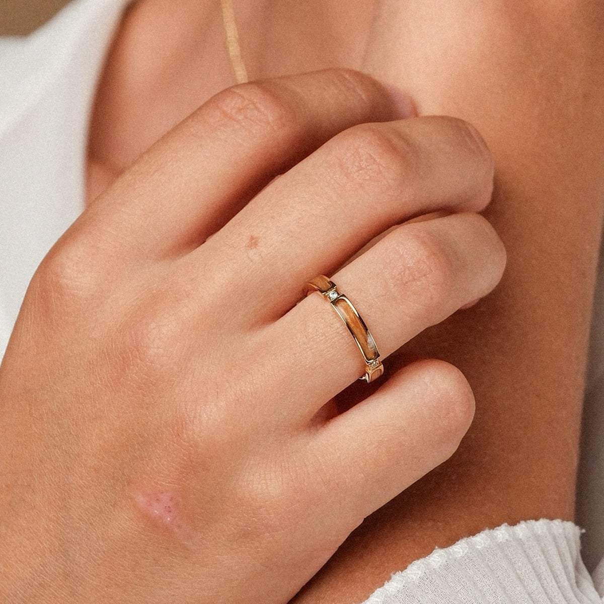 "Campania Ring" - gold and olive ring with a sleek, minimalist design.