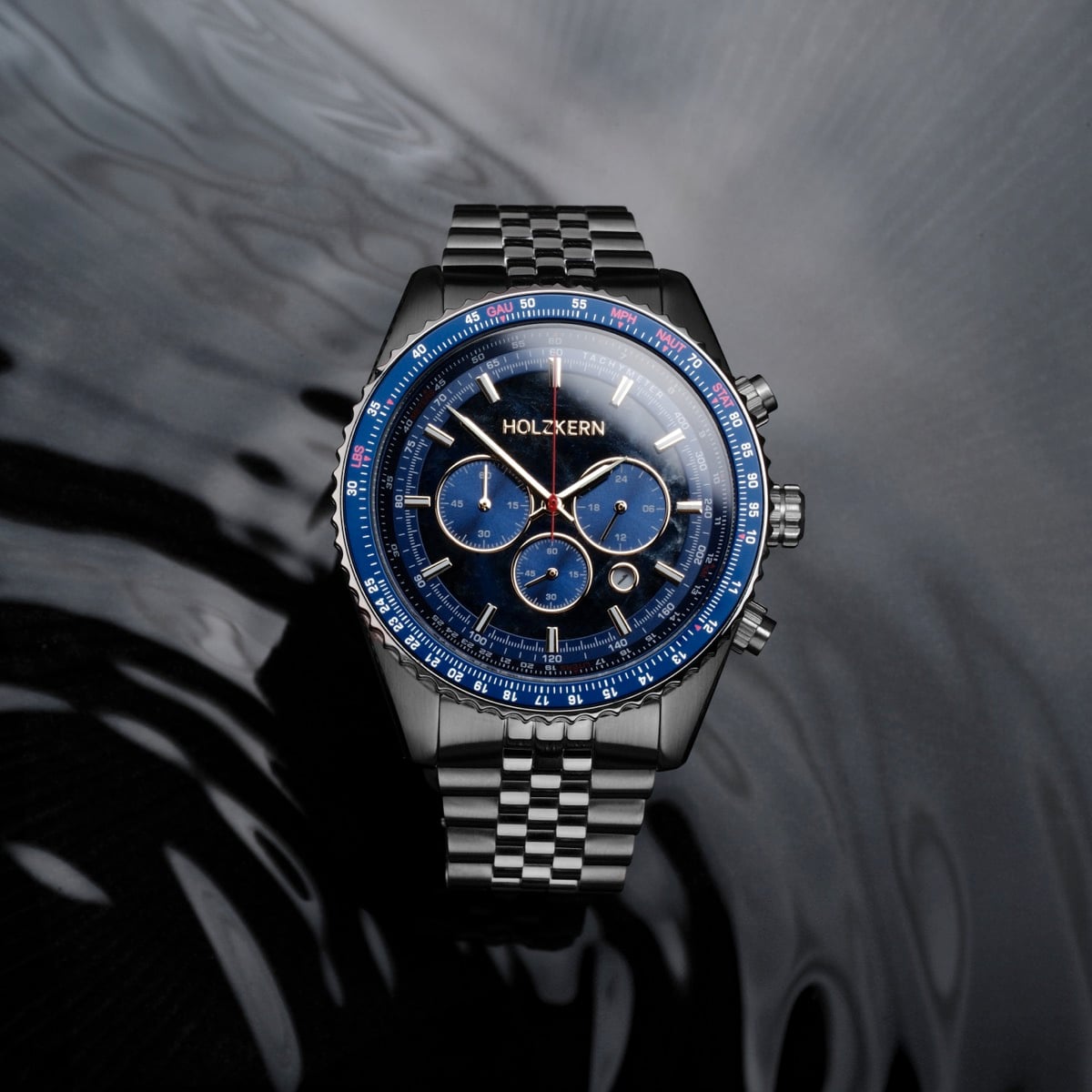 "Openhorizon" watch, featuring a blue marble dial and silver accents with a sleek, modern style.