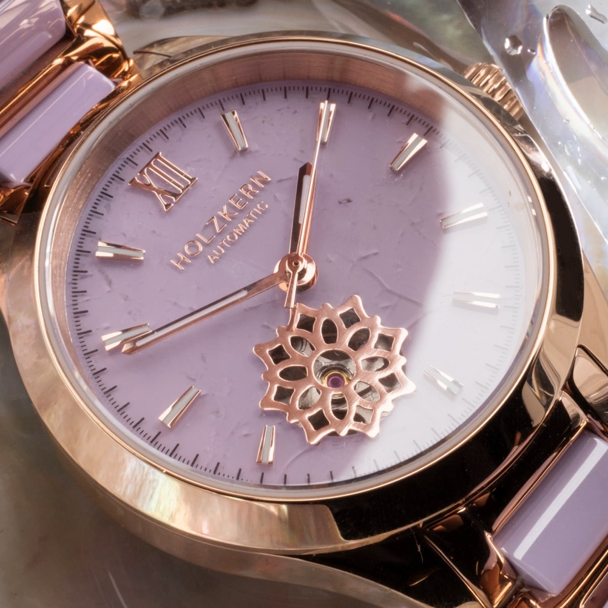 "Kaleidoscopic" watch featuring an amethyst-toned face with intricate ceramic accents and a kaleidoscopic design.
