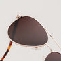 "The Badass II" sunglasses, featuring a walnut and matte gold design.