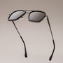 "The Logician" sunglasses featuring a sleek leadwood and antique silver design.